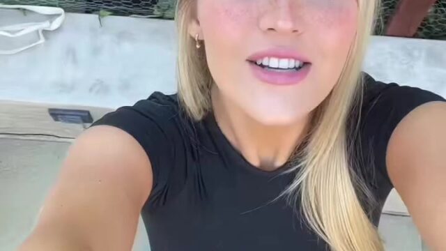 sexy blonde Allie Dunn talking on camera